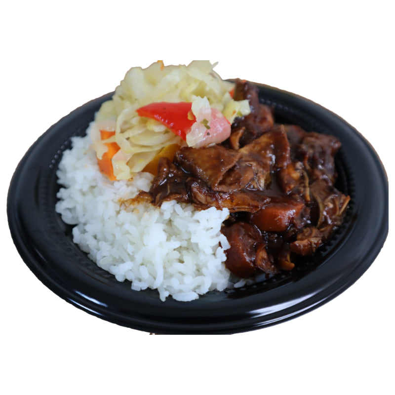 Black plate with rice, brown stew chicken, and vegetables on a white background