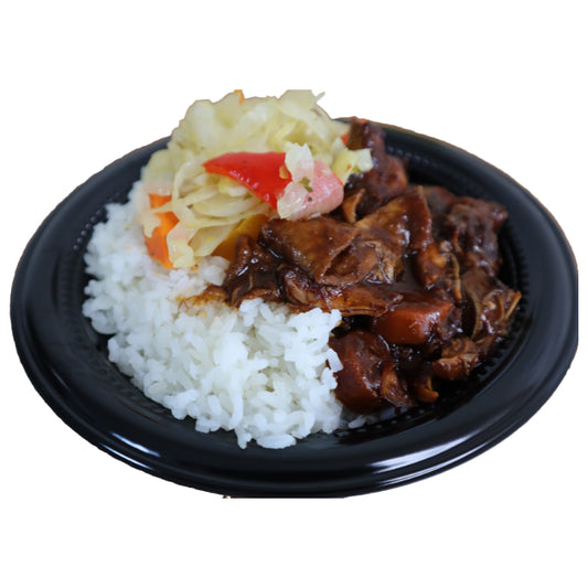 Black plate with rice, brown stew chicken, and vegetables on a white background